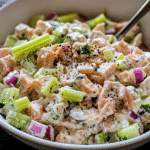 Close-up of tuna salad in a bowl with celery and onion mixed in