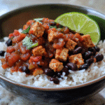 Chipotle Sofritas Copycat tofu crumbles over rice with beans, salsa, and lime