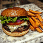 Portobello mushroom burger on a toasted bun with cheese lettuce tomato and onion