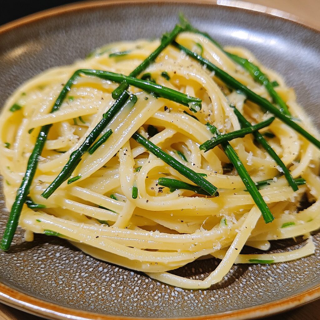Garlic Scape Pasta Easy Summer Recipes served on a plate in natural light