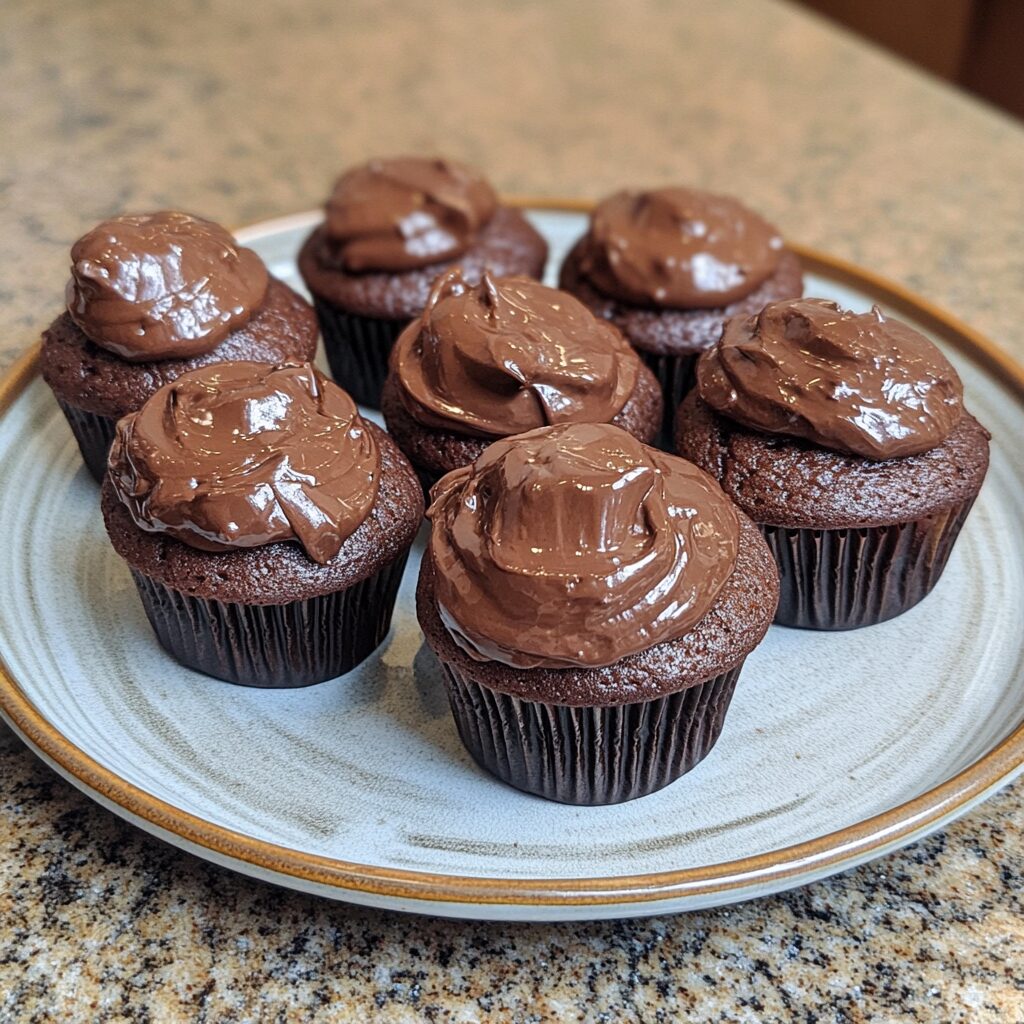 Ultimate Double Chocolate Cupcakes served on a plate in natural light